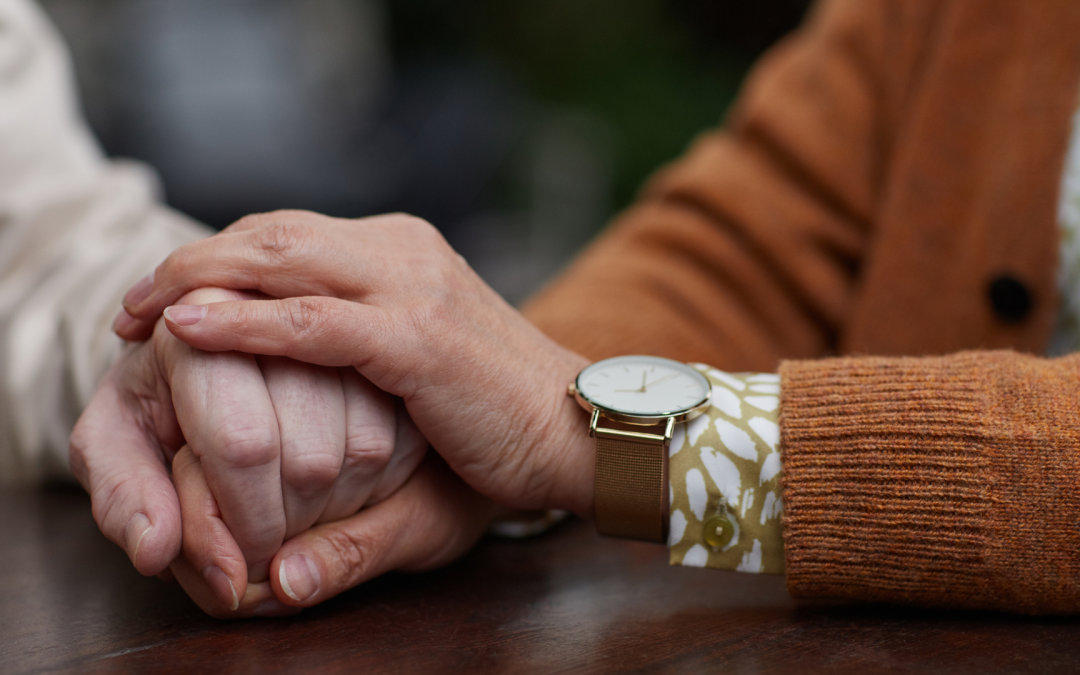 Two people holding hands