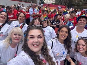 Group of LDVS staff taking selfie in parade at Leeds Pride